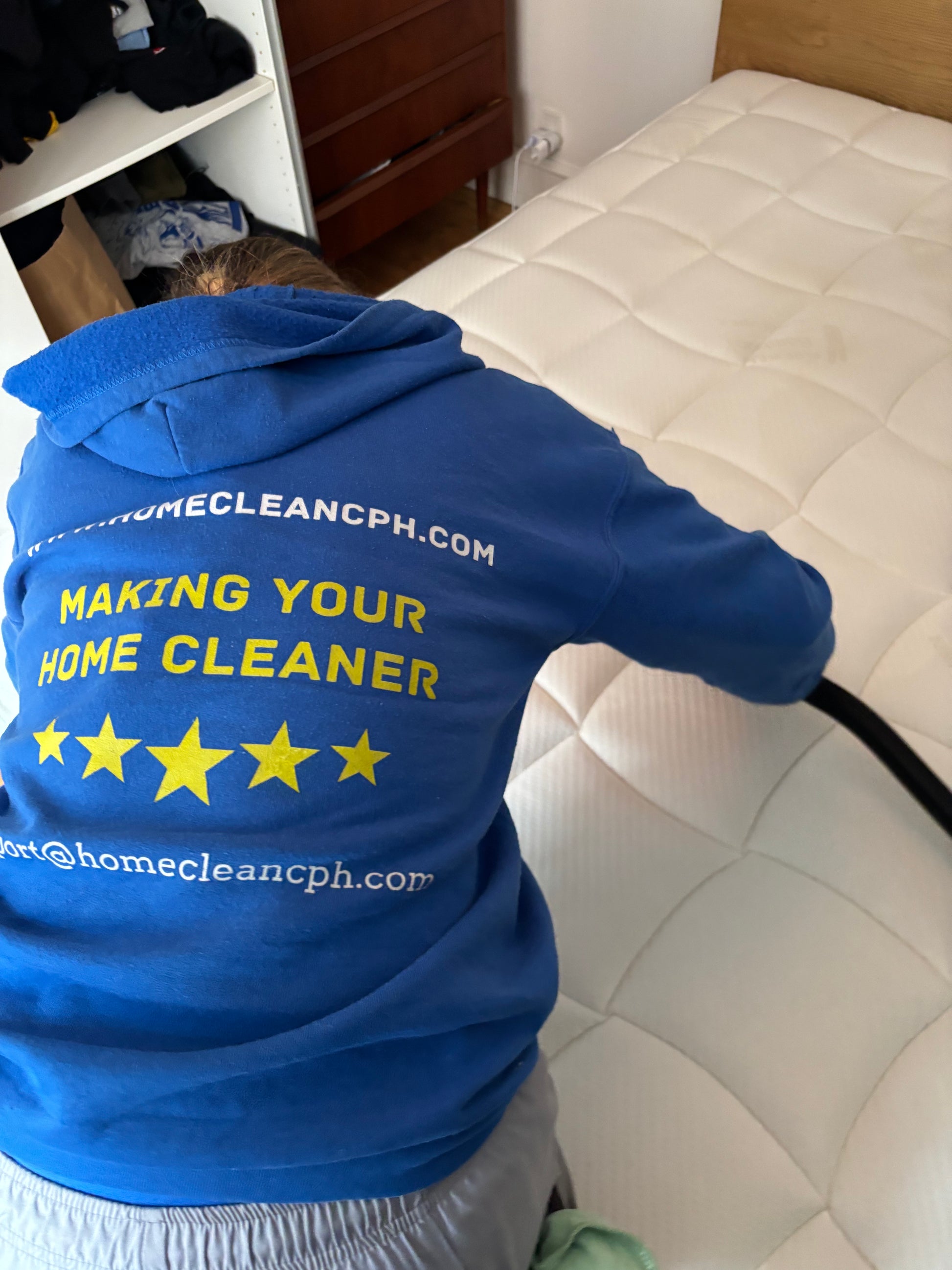 Professional mattress cleaning service in Copenhagen, showing technician cleaning a mattress for better hygiene.